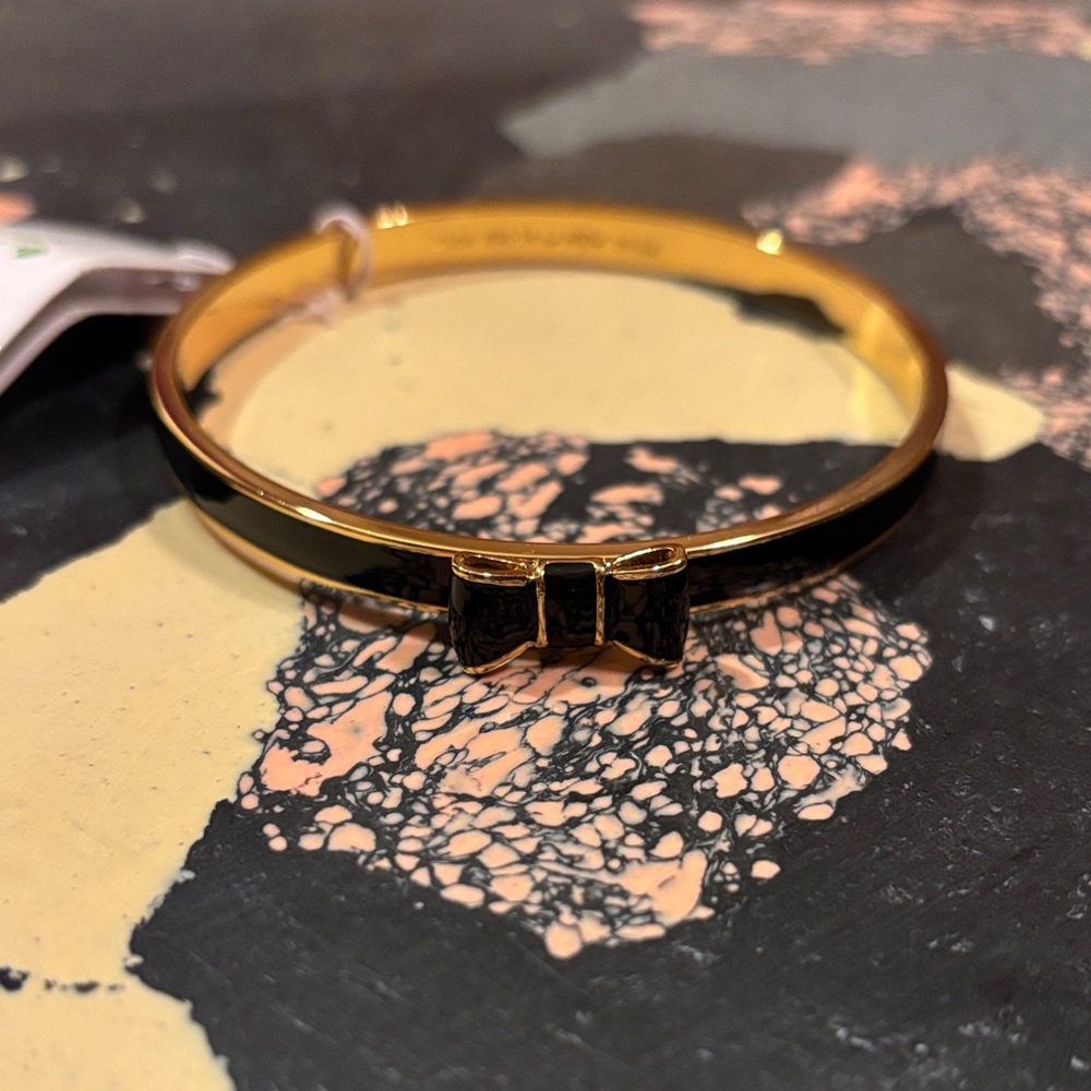 Reposhing - kate spade Gold and Black Bow Hinged Bangle Bracelet